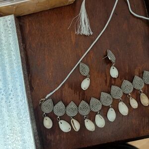 Layered Silver and Cream Necklace with Textured Design shells
